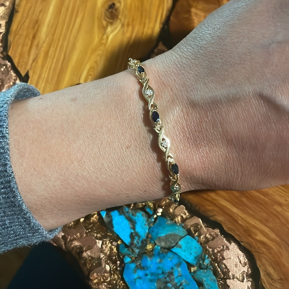 "Sapphire Serenade: Marquise Blue Sapphire and Diamond Tennis Bracelet in 14K"